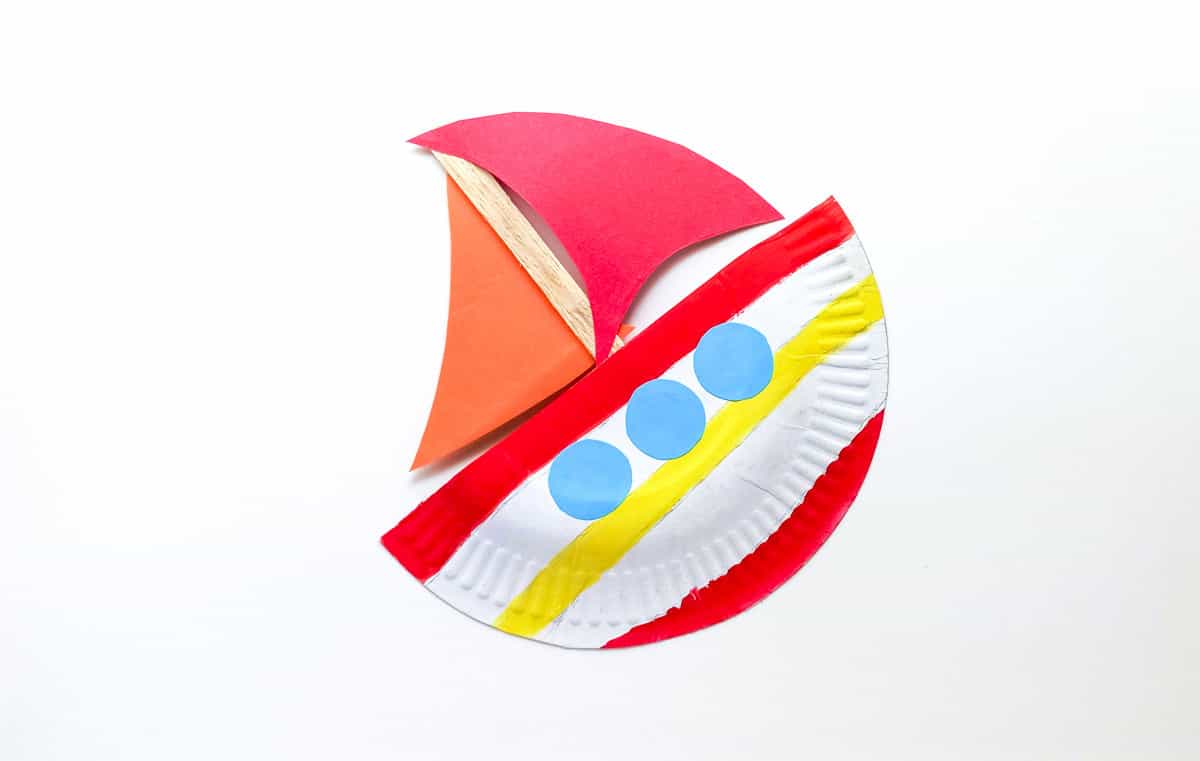 glue popsicle stick to back of paper plate boat
