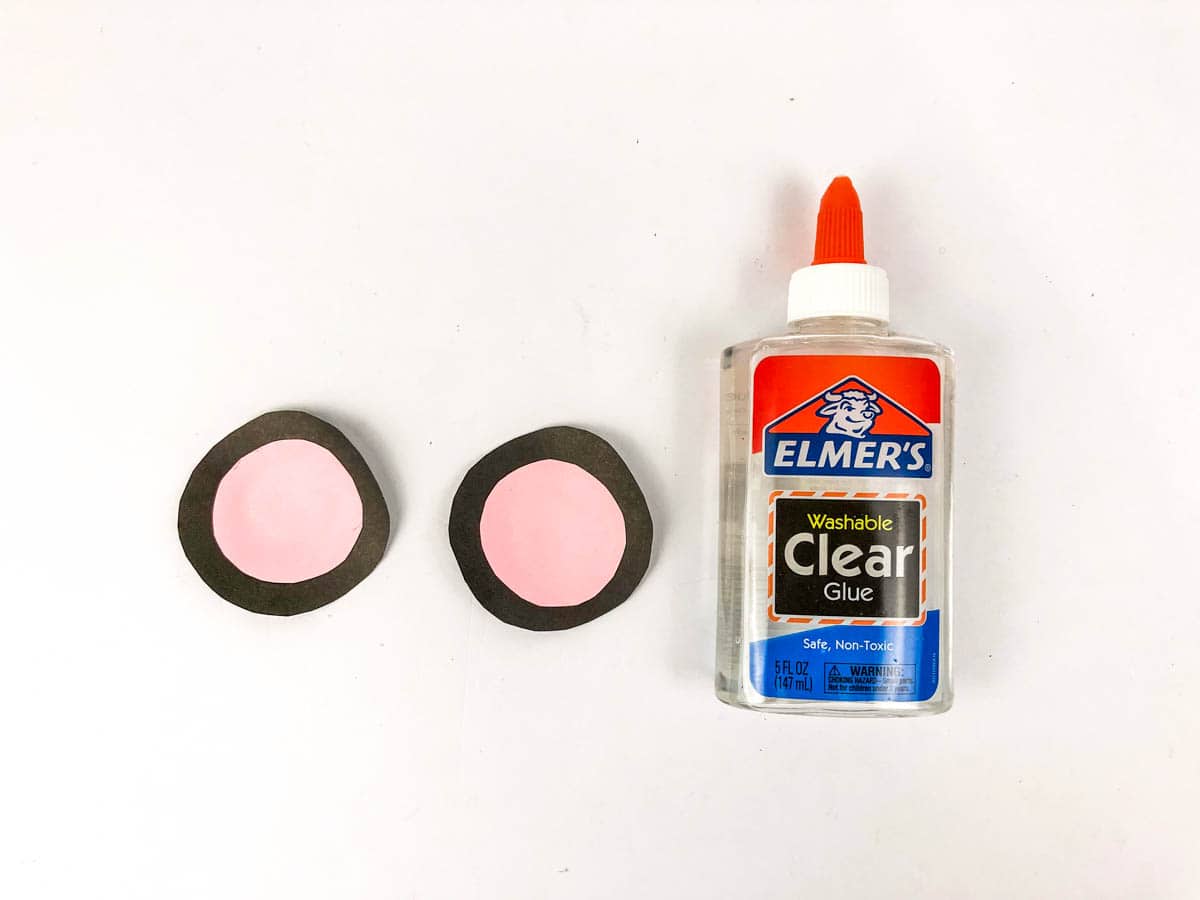 glue small pink circles to black circles ears