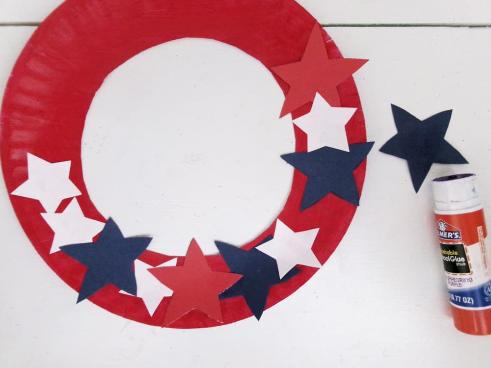 Glue Stars to Paper Plate Wreath