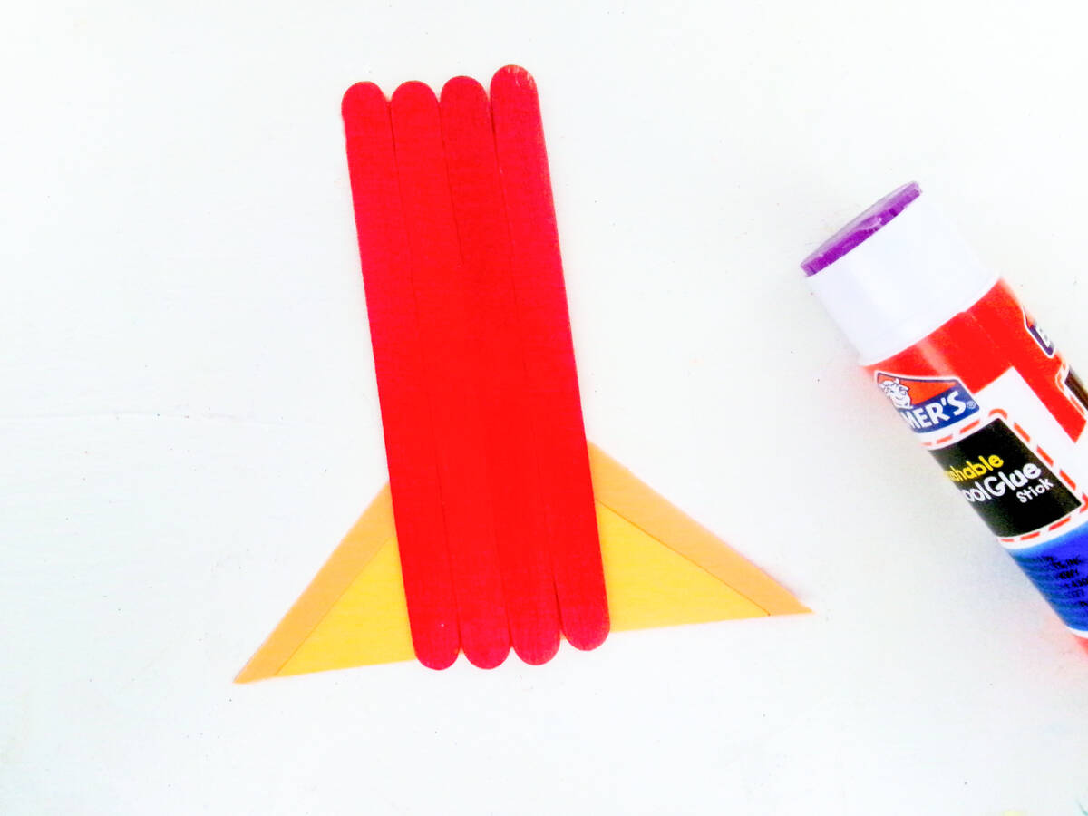 glue triangles to back of rocket ship popsicle sticks