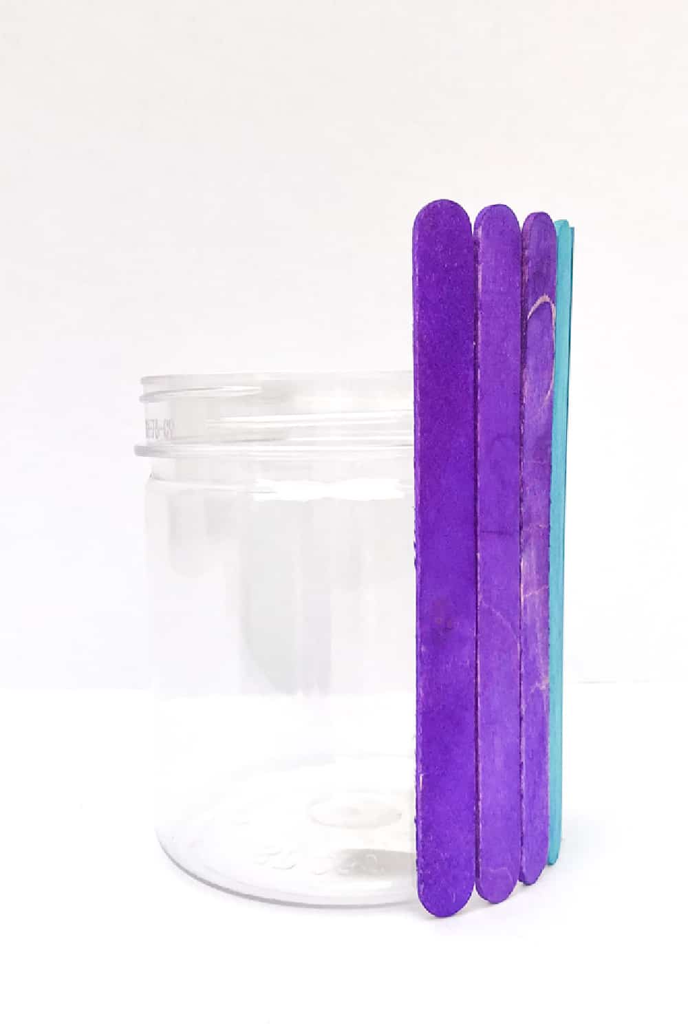 glued popsicle sticks to jar