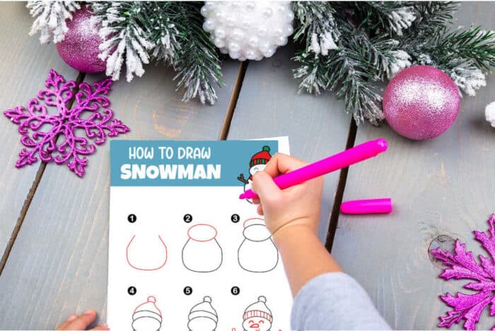 a child learning to draw a snowman