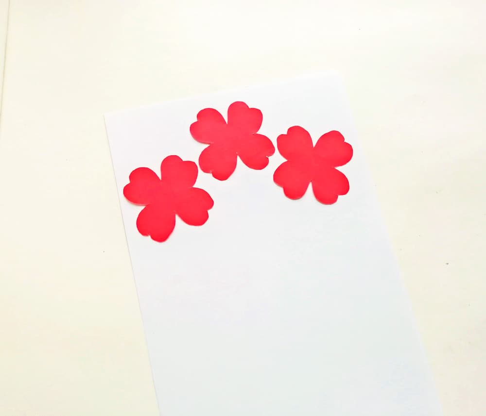 Glue the flowers on the card.