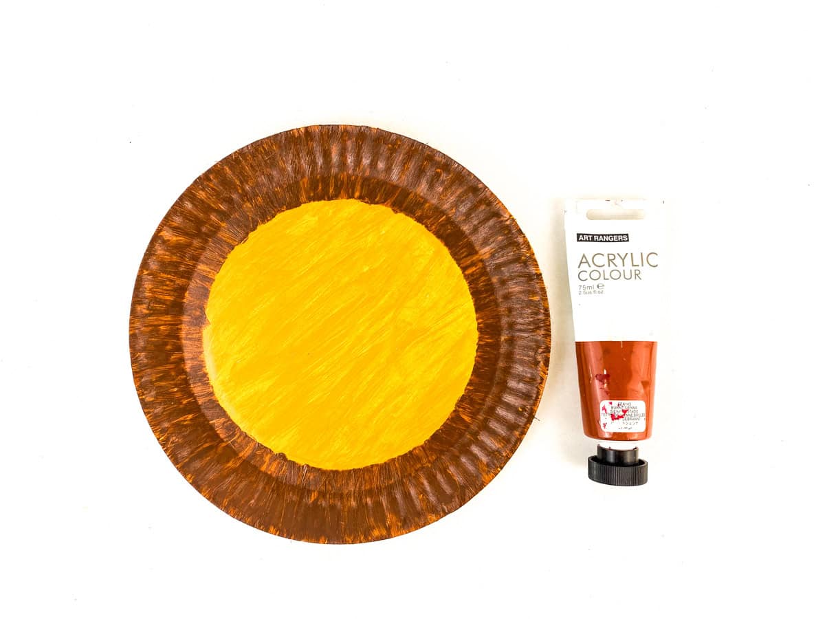 paint outer ring of paper plate brown for lion craft