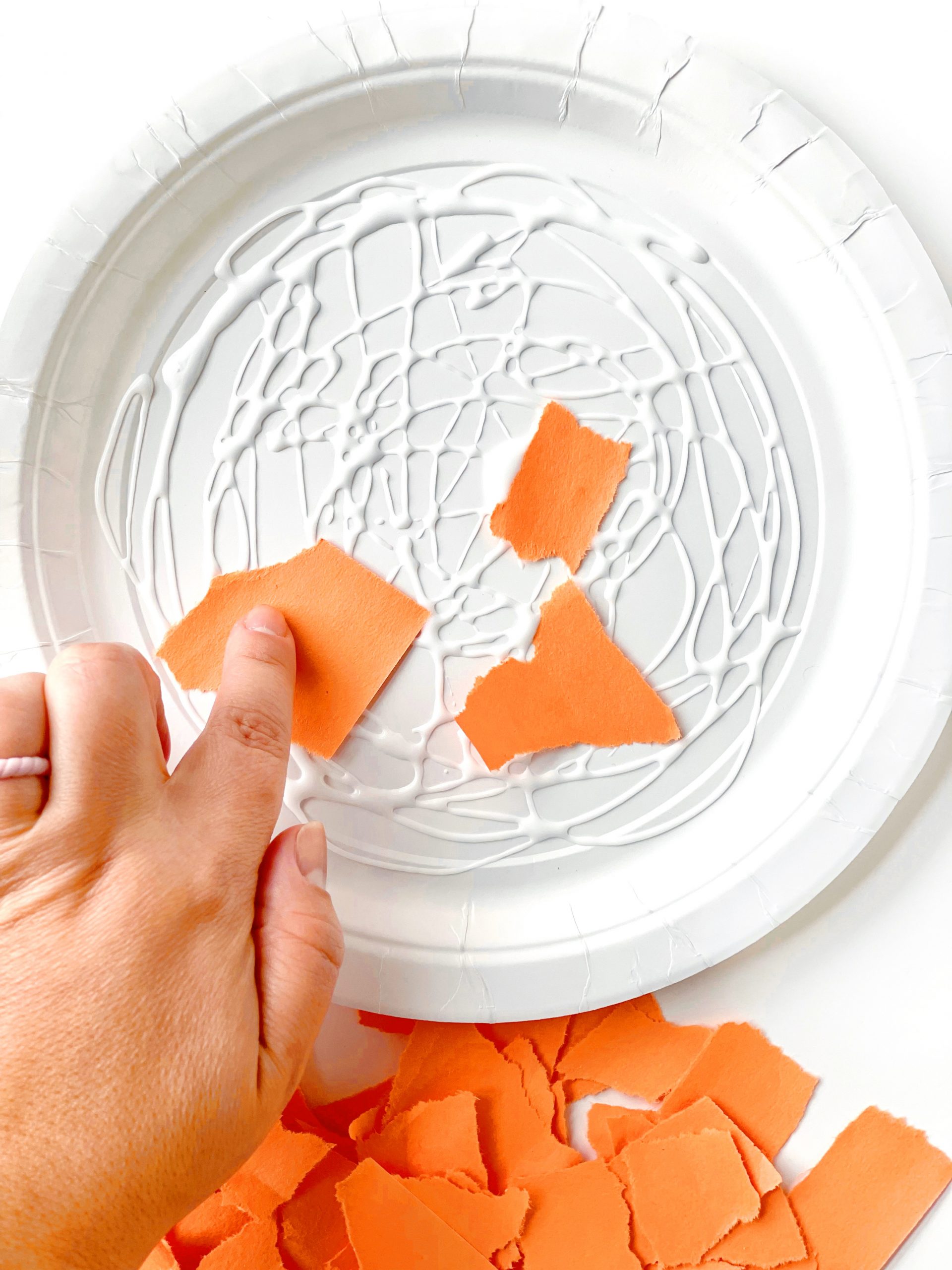 paper plate pumpkin pie craft gluing