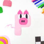 A pig crafted from pink paper shaped like the letter P, with added ears, eyes, and snout. Colored markers, glittery shapes, and colorful papers surround the pig on a white background—perfect for pairing with L is for Lion crafts.