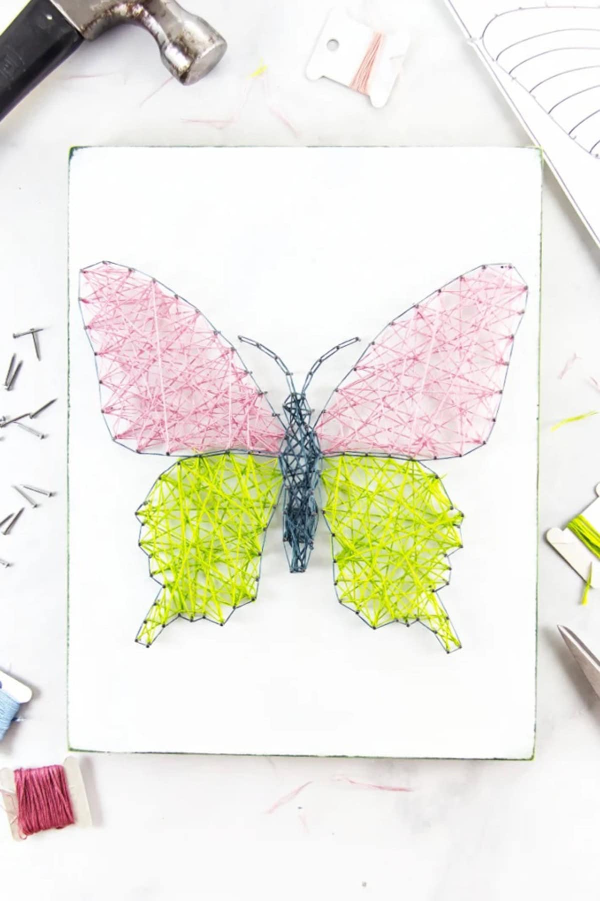 pink and green string art butterfly