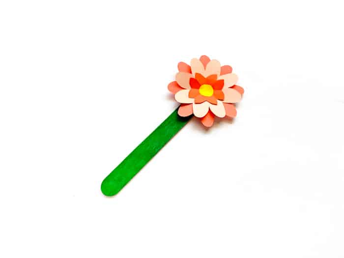 adding paper flower to craft stick