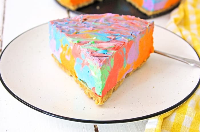 Slice of rainbow cheesecake