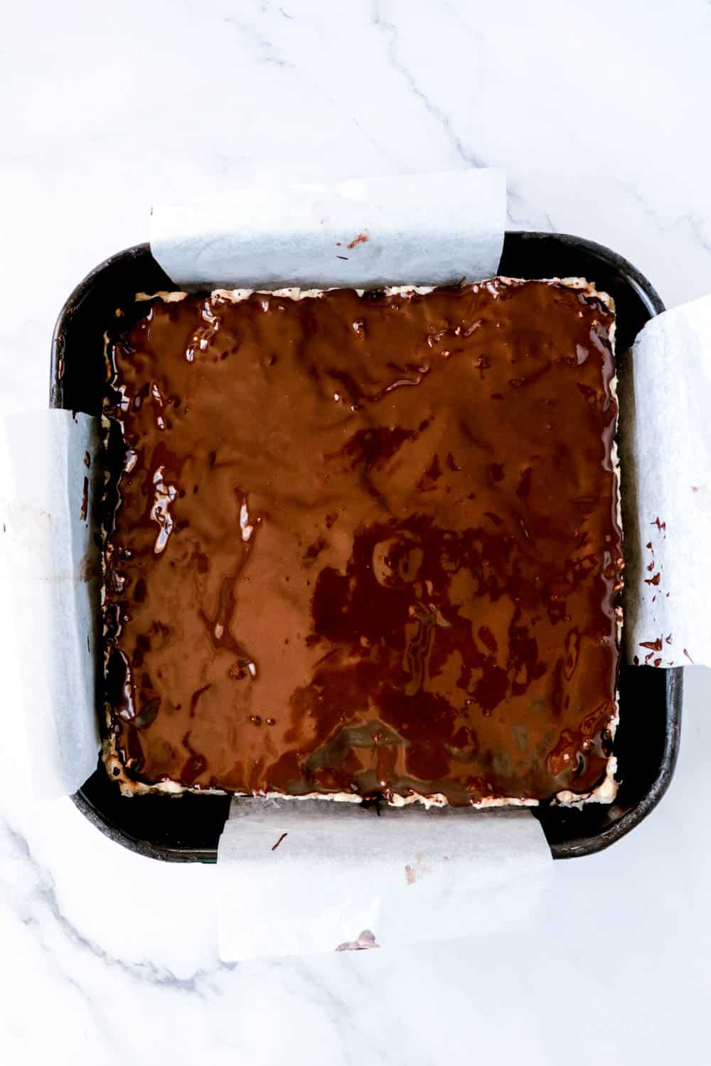 spread chocoate on top of rice krispie treats