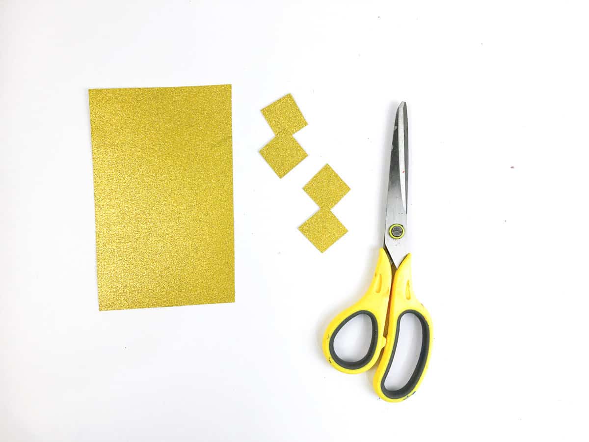 step 2 cut second yellow paper into small squares