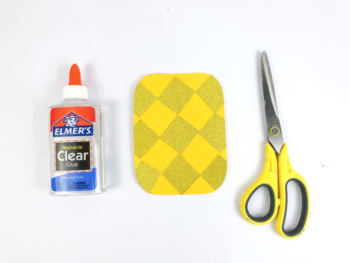 step 5 glue yellow squares to top of pineapple shape