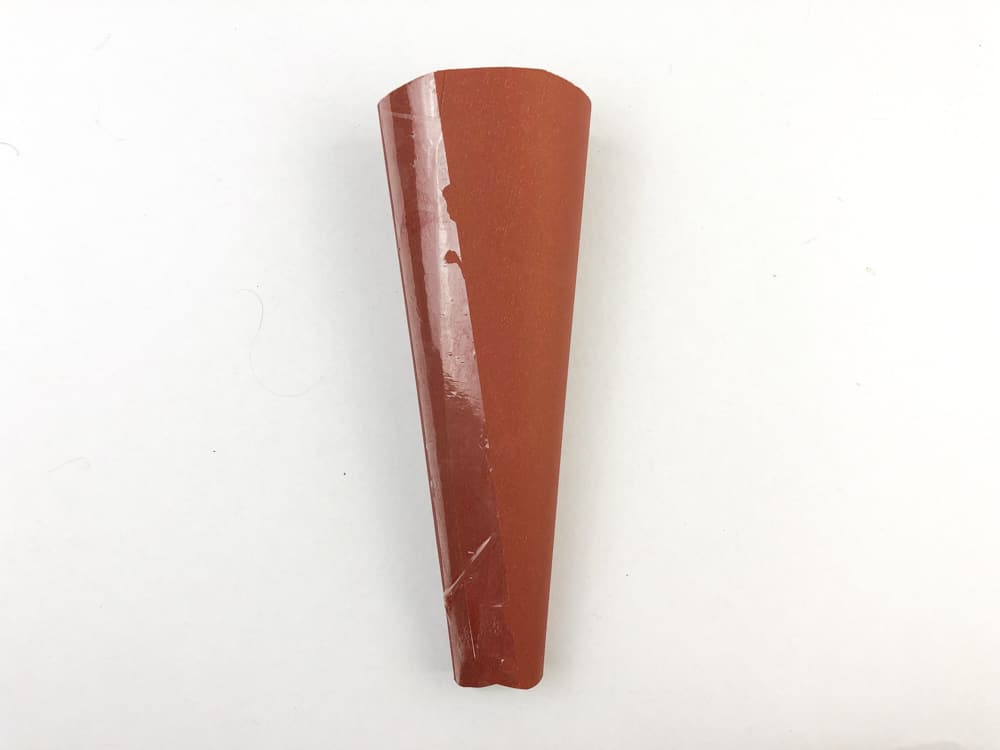 tape brown paper into cone