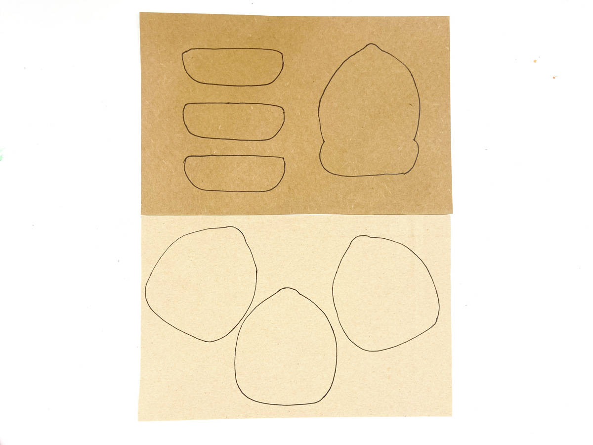trace three light brown and tops on dark brown paper