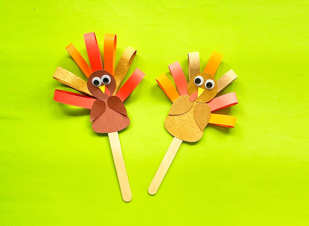 Attached popsicle stick to paper turkey