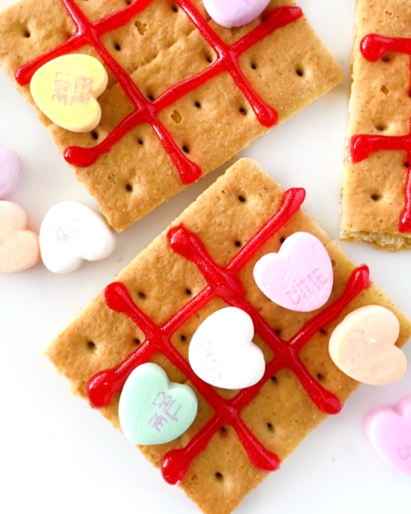 crackers with icing and conversation hearts