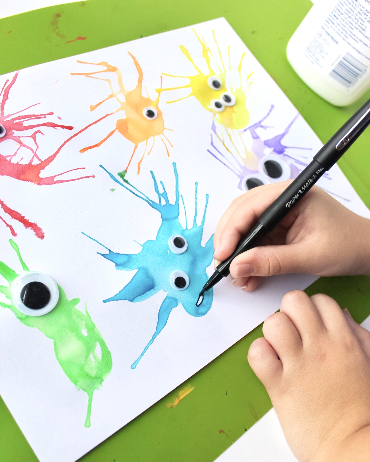 child drawing mouths on monsters craft