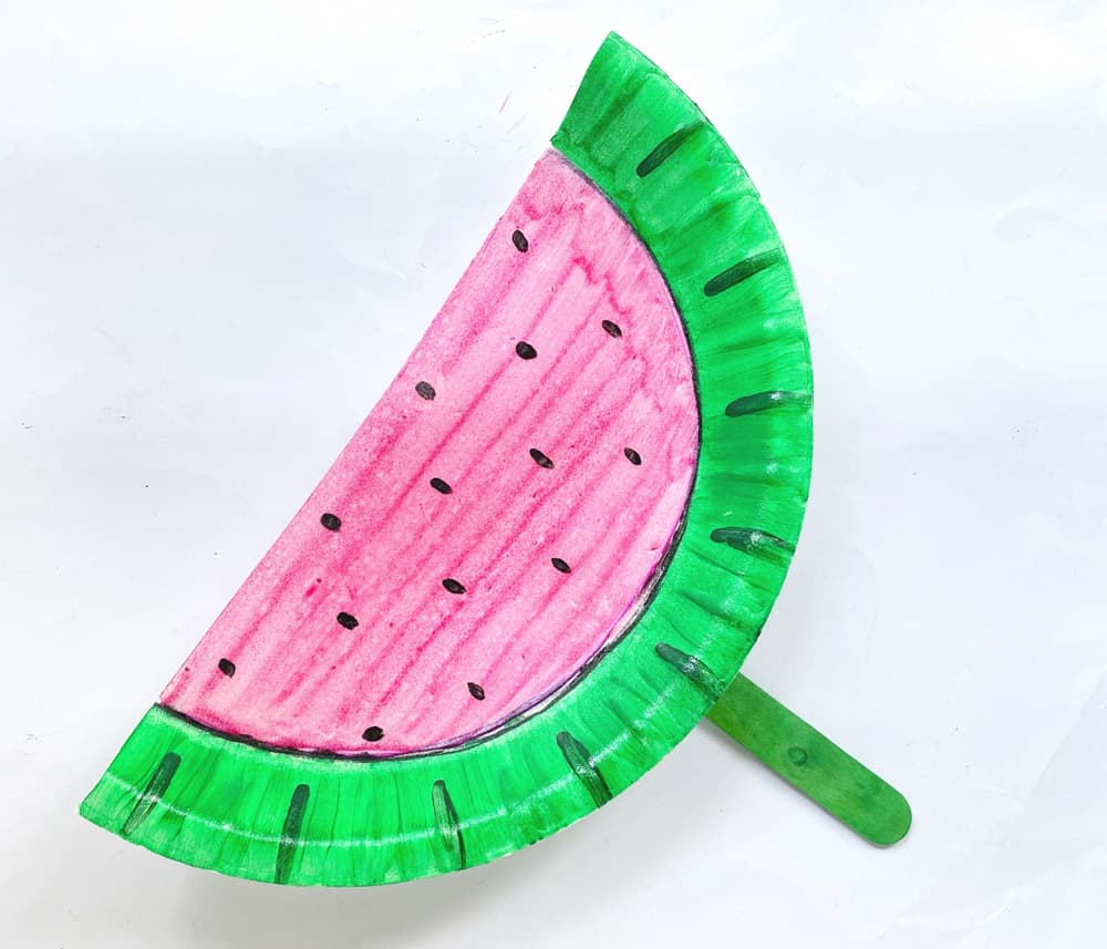 glue or tape popsicle stick to back of watermelon