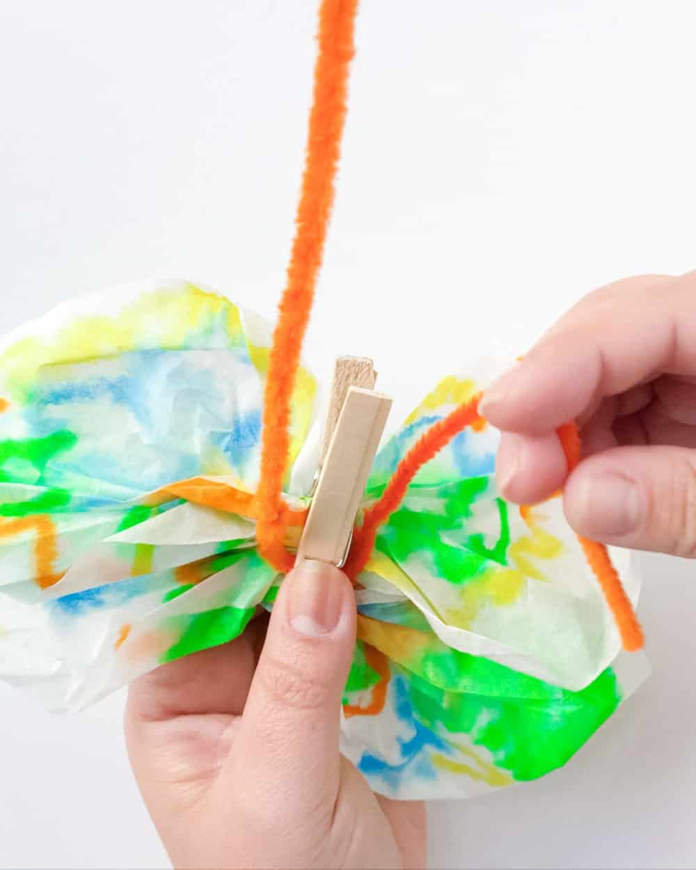 Wrap pipe cleaner under clothes pin